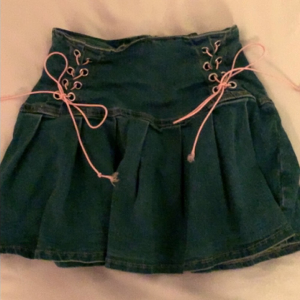 its a laced up pleaded denim skirt.